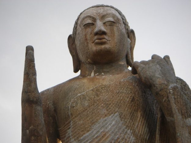 At Okkampitiya, a 10 meter tall Buddha from the 7th century looks down At Okkampitiya, a 10 meter tall Buddha from the 7th century looks down